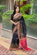 Woman wearing a traditional saree with a garden background